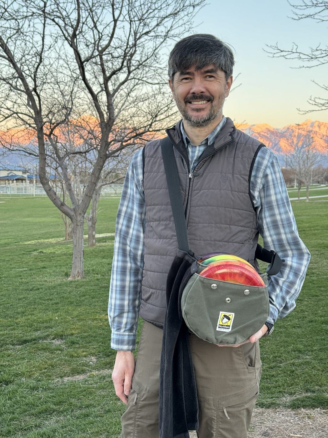 Jon Barney at sunset with a disc, 2026